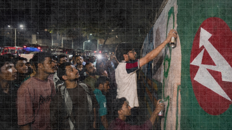 Jatiyo Chhatra Shakti activists repaint graffiti on a wall in Chattogram during a night-time protest programme defending the memory of the July Mass Uprising.