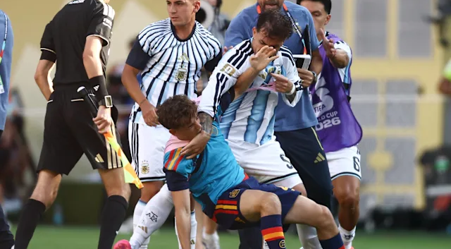 Frustrated Argentine players clashing with the Spanish team on the pitch at MetLife Stadium following the 1-0 World Cup final defeat.