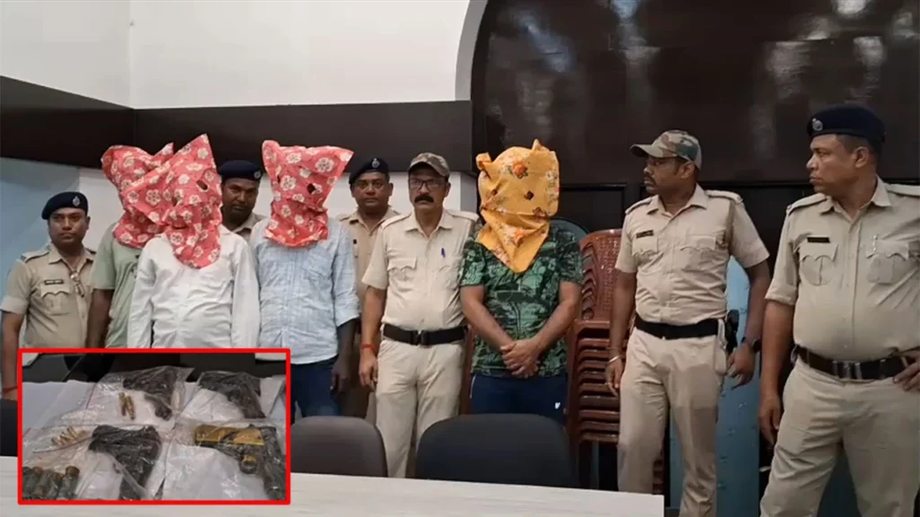 Seized illegal firearms, magazines, and ammunition laid out by West Bengal Police following the arrest of four cross-border arms smugglers in Murshidabad.